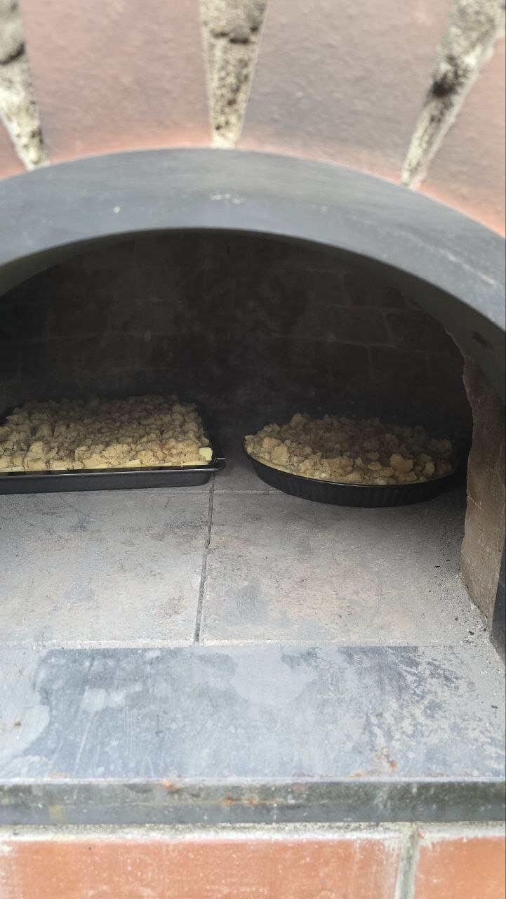 Two crumble cakes baking in the oven